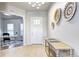 Bright entryway with decorative wall art, tile flooring, and a view into the living space at 365 Casalon Pl, Superior, CO 80027