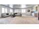 Cozy living room with soft carpeting, comfortable seating, and a convenient bar area for seamless entertaining at 365 Casalon Pl, Superior, CO 80027