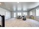 Spacious living room with plush carpeting, bright windows, and stylish furniture perfect for entertaining and relaxation at 365 Casalon Pl, Superior, CO 80027