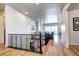 Open concept living space with hardwood floors, modern staircase and abundant natural light at 365 Casalon Pl, Superior, CO 80027