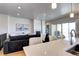 Cozy living room featuring a fireplace, plush seating, and a seamless flow to the balcony at 365 Casalon Pl, Superior, CO 80027