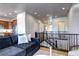 Open living room with staircase, comfortable seating, and seamless flow into the kitchen at 365 Casalon Pl, Superior, CO 80027