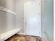 Inviting mudroom featuring hooks, bench, and tiled flooring providing a practical and stylish transition space at 365 Casalon Pl, Superior, CO 80027