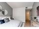 Bright bedroom with ensuite bath access boasts stylish accents and neutral decor at 8500 E Jefferson Ave # 7B, Denver, CO 80237