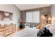 Comfortable bedroom with neutral colors, a decorative dresser, and natural light at 8500 E Jefferson Ave # 7B, Denver, CO 80237