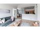 Open-concept living space flows into dining area, with stylish furnishings and ample natural light at 8500 E Jefferson Ave # 7B, Denver, CO 80237