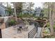 Scenic community patio featuring a dining table and chairs with tranquil views of a pond at 8500 E Jefferson Ave # 7B, Denver, CO 80237