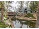 A tranquil community pond with a fountain and inviting seating areas surrounded by lush landscaping at 8500 E Jefferson Ave # 7B, Denver, CO 80237