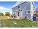 Outdoor patio and seating area with an adjacent grassy space and easy access via a glass sliding door at 10301 E 112Th Way, Commerce City, CO 80640
