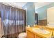 Practical bathroom with a shower-tub combination, neutral walls and a vanity at 10301 E 112Th Way, Commerce City, CO 80640