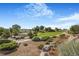 Beautifully landscaped community park with walking paths, mature trees, and open green spaces at 10301 E 112Th Way, Commerce City, CO 80640