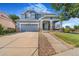 Charming two-story home with a covered front porch, large driveway and beautiful landscaping at 10301 E 112Th Way, Commerce City, CO 80640
