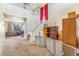 Spacious foyer with staircase and view into the living room at 10301 E 112Th Way, Commerce City, CO 80640