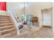 Bright foyer features soaring ceilings and staircase, leading to the upper level at 10301 E 112Th Way, Commerce City, CO 80640
