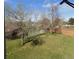 Spacious backyard features a large lawn, mature trees, and privacy fencing; ideal for outdoor activities at 2231 Sable Blvd # 909, Aurora, CO 80011