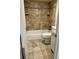 Bathroom featuring a tiled shower and tub combo, toilet, and vanity at 2231 Sable Blvd # 909, Aurora, CO 80011