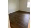 Bedroom showcasing wood floors and natural light from the window at 2231 Sable Blvd # 909, Aurora, CO 80011
