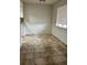 Dining room featuring tiled floor and window at 2231 Sable Blvd # 909, Aurora, CO 80011
