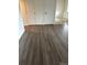 Hallway featuring hard wood flooring and large closet at 2231 Sable Blvd # 909, Aurora, CO 80011
