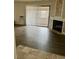 Bright living room featuring wood floors, fireplace and balcony access through sliding glass doors at 2231 Sable Blvd # 909, Aurora, CO 80011
