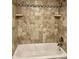 Shower showcasing tiled walls, bathtub and shower head at 2231 Sable Blvd # 909, Aurora, CO 80011