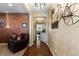 Inviting hallway with hardwood floors, decorative wall accents, and stylish decor, creating a warm and welcoming atmosphere at 8104 El Jebel Loop, Castle Rock, CO 80108