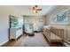 Cozy bedroom features two windows with natural light and neutral paint at 11754 W 28Th Ave, Lakewood, CO 80215