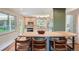 Bright kitchen with stainless steel appliances, a butcher block island with seating, and ample cabinet space at 11754 W 28Th Ave, Lakewood, CO 80215