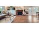 Spacious living room with a fireplace, built-in shelving, and access to the backyard at 11754 W 28Th Ave, Lakewood, CO 80215