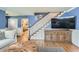 Stylish living room with hardwood floors, blue walls, and a staircase leading to the upper level, well decorated at 11754 W 28Th Ave, Lakewood, CO 80215