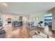 Open concept living area with a kitchen bar, dining space, and cozy seating area at 11754 W 28Th Ave, Lakewood, CO 80215