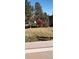 View of backyard with trees and grass at 4760 S Wadsworth Blvd # H207, Littleton, CO 80123