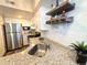 Stainless steel sink and faucet in a modern kitchen at 4760 S Wadsworth Blvd # H207, Littleton, CO 80123