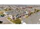 A sunny aerial view of a residential community with neat landscaping and well-maintained townhomes at 9758 Laredo St # 18D, Commerce City, CO 80022