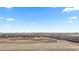 Expansive aerial view showcases future community development and its proximity to key urban areas at 9758 Laredo St # 18D, Commerce City, CO 80022