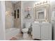 Bathroom features shower, tub, toilet, vanity, updated fixtures, and decor at 9758 Laredo St # 18D, Commerce City, CO 80022