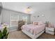 Bedroom with neutral paint, carpet, windows, dresser, night stands, and queen size bed with pillows at 9758 Laredo St # 18D, Commerce City, CO 80022