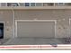 Exterior view of garage door with 18D number at 9758 Laredo St # 18D, Commerce City, CO 80022