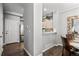 View of the small kitchenette area with light cabinets, white countertops and backsplash, and stainless steel appliances at 9758 Laredo St # 18D, Commerce City, CO 80022