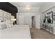 Bright main bedroom with crystal chandelier and ensuite bathroom and walk-in closet at 9758 Laredo St # 18D, Commerce City, CO 80022