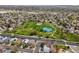 Drone shot of a community park including walking paths and a tennis court, all in a residential neighborhood at 12552 Tammywood St, Broomfield, CO 80020