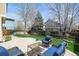 Private backyard patio featuring an outdoor seating area and manicured lawn at 12552 Tammywood St, Broomfield, CO 80020