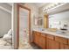 Bathroom with a tub/shower combo, a double sink vanity, and tile floors at 12552 Tammywood St, Broomfield, CO 80020