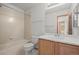 Bathroom with white shower/tub combo and single sink vanity with ample storage at 12552 Tammywood St, Broomfield, CO 80020