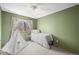 Bright bedroom with a decorative teepee tent, carpeted floors, and a window for natural light at 12552 Tammywood St, Broomfield, CO 80020