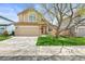 Charming two-story home featuring a well-manicured lawn and a two-car garage at 12552 Tammywood St, Broomfield, CO 80020