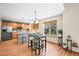 Eat-in kitchen featuring stainless steel appliances, wooden cabinets, and a breakfast nook at 12552 Tammywood St, Broomfield, CO 80020