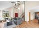 Bright living room with hardwood floors, comfortable seating, and staircase access at 12552 Tammywood St, Broomfield, CO 80020