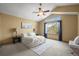 Main bedroom featuring large window for natural light, ceiling fan, and sitting area at 12552 Tammywood St, Broomfield, CO 80020