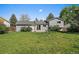 A charming home featuring a spacious backyard and a sliding glass door leading to the outdoor patio at 1043 Lilac Ct, Broomfield, CO 80020